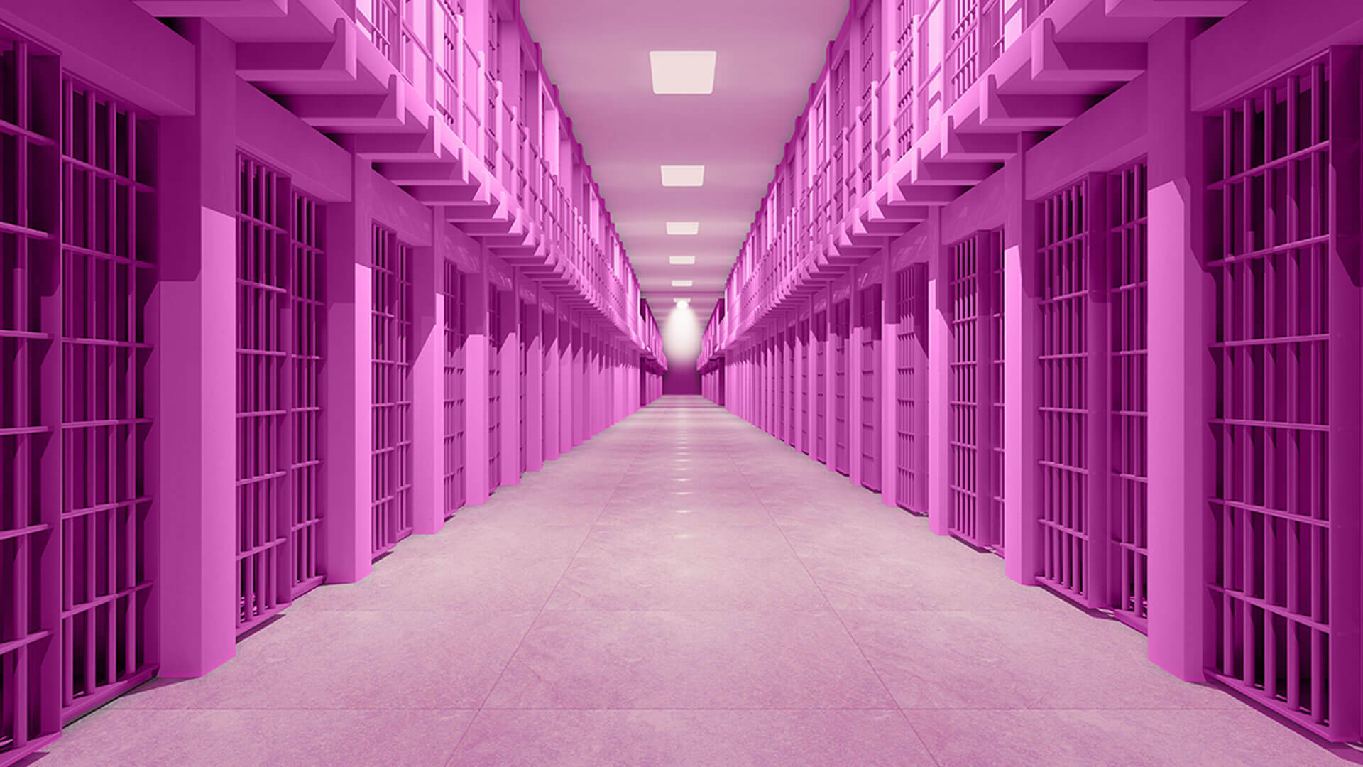 A symmetrical view of a long, empty prison corridor with barred cells on both sides, all tinted in a bright pink hue under overhead lights.